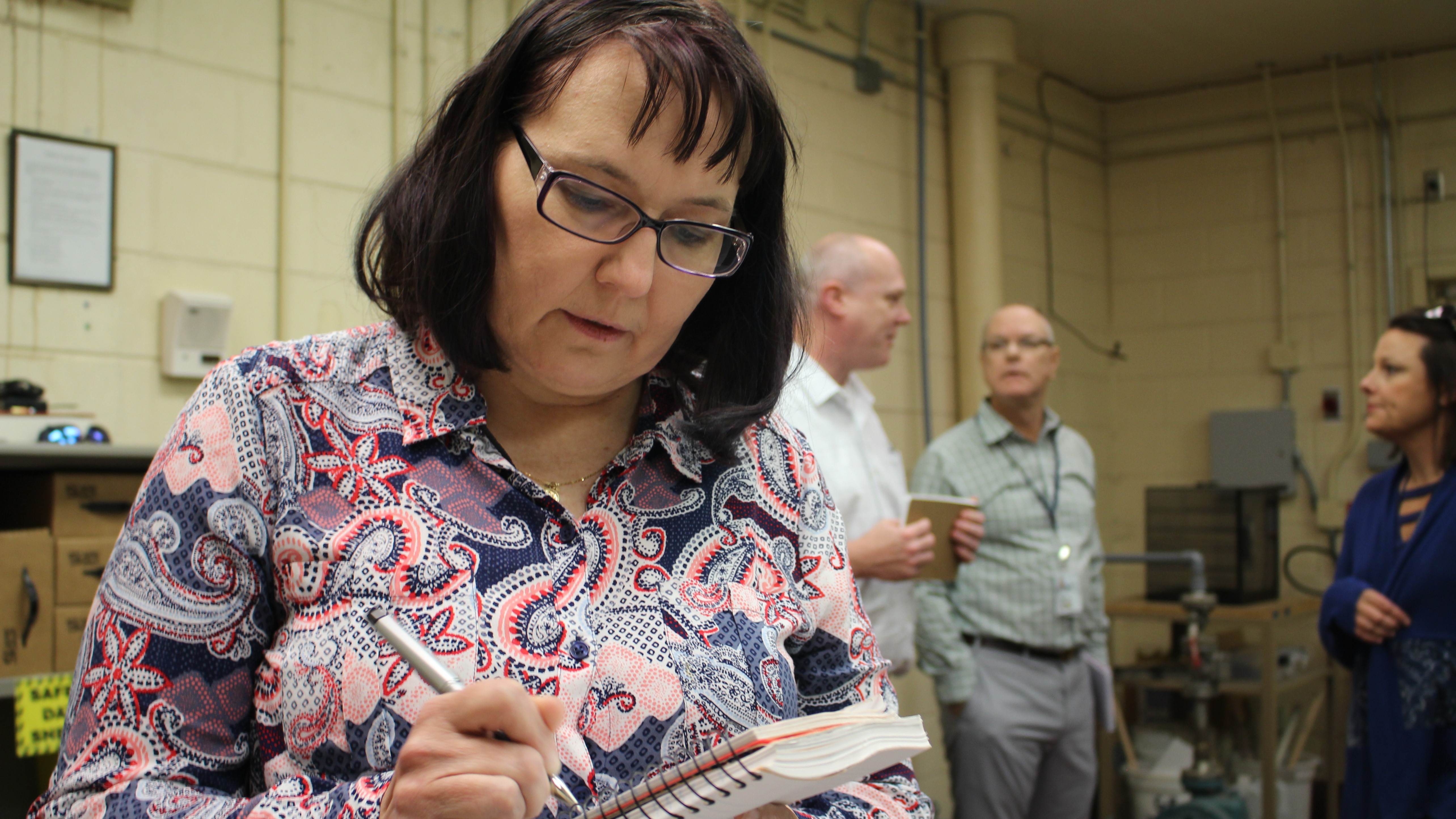 Army Materiel Command Inspector Penny Pretrowski jots down an observation during the compliance review.
